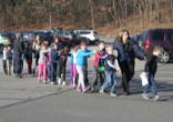 children being led out of the school Image of children being led out of the school