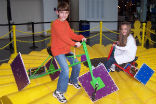 The Math Midway is the only place where you can ride a square-wheeled tricycle. Image of The Math Midway is the only place where you can ride a square-wheeled tricycle.