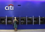 Citibank is cutting jobs and costs in the face of new regulations and fiscal uncertainty. Image of Citibank is cutting jobs and costs in the face of new regulations and fiscal uncertainty.