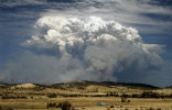 A brush fire rages near Hobart, on Jan. 3, creating this spectacular site for rural residents. Such events are expected to be more common in the decades to come. Image of A brush fire rages near Hobart, on Jan. 3, creating this spectacular site for rural residents. Such events are expected to be more common in the decades to come.