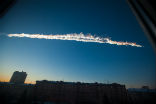 The meteorite streaked a twin contrail in the sky over Chelyabinsk. Image of The meteorite streaked a twin contrail in the sky over Chelyabinsk.
