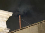 Black smoke means there will be another day of voting tomorrow. Image of Black smoke means there will be another day of voting tomorrow.