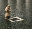 A pilgrim waits in yesterday's rain for the announcement that a new pope has been chosen. The pilgrim represents all of the faithful who wait in prayer. Image of A pilgrim waits in yesterday's rain for the announcement that a new pope has been chosen. The pilgrim represents all of the faithful who wait in prayer.
