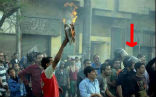 Egyptian police stand in the crowd as Muslims burn a Bible before a Coptic cathedral. What would happen if the roles were reversed? Image of Egyptian police stand in the crowd as Muslims burn a Bible before a Coptic cathedral. What would happen if the roles were reversed?