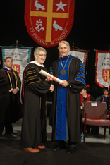 Photo by Gary Fountain
Robert George accepts an honorary degree from University President Dr. Robert Ivany. Image of Photo by Gary Fountain
Robert George accepts an honorary degree from University President Dr. Robert Ivany.