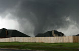 The deadly tornado as it approaches homes in Moore, OK. Image of The deadly tornado as it approaches homes in Moore, OK.
