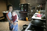 Du Xiurong with her grandchild, for whom she also says she will sell everything to ensure he has a good education. Image of Du Xiurong with her grandchild, for whom she also says she will sell everything to ensure he has a good education.