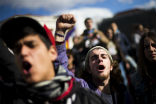 Young protesters come out to rally against high unemployment and government cuts. Image of Young protesters come out to rally against high unemployment and government cuts.