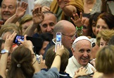 Pope moves through the crowd to give his general audience Image of Pope moves through the crowd to give his general audience
