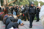 A police officer on the campus of UC Davis in California, a victim of annoyance. Image of A police officer on the campus of UC Davis in California, a victim of annoyance.