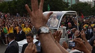 Pope Francis greeting the thousands who gathered upon his arrival in Brazil Image of Pope Francis greeting the thousands who gathered upon his arrival in Brazil