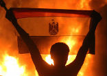 Fighting broke out throughout Cairo and in other cities in response to the police action. Government buildings and Christian churches were attacked. The Brotherhood's response appeared to be calculated, and government sources said that some protesters were armed and fired upon them. Over 600 persons have been killed and over 4000 have been injured. And the number keeps climbing as the violence drags on.
Image of Fighting broke out throughout Cairo and in other cities in response to the police action. Government buildings and Christian churches were attacked. The Brotherhood's response appeared to be calculated, and government sources said that some protesters were armed and fired upon them. Over 600 persons have been killed and over 4000 have been injured. And the number keeps climbing as the violence drags on.