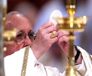 Pope Francis elevating the Consecrated Host at Holy Mass Pope Francis elevating the Consecrated Host at Holy Mass