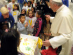 Children helped Pope Francis blow the candles out on his birthday cake. Image of Children helped Pope Francis blow the candles out on his birthday cake.