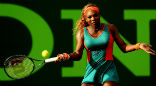 Serena Williams, who owns part of the Miami Dolphins football team, wore an outfit reflecting the teams colors during her match on March 20. Image of Serena Williams, who owns part of the Miami Dolphins football team, wore an outfit reflecting the teams colors during her match on March 20.