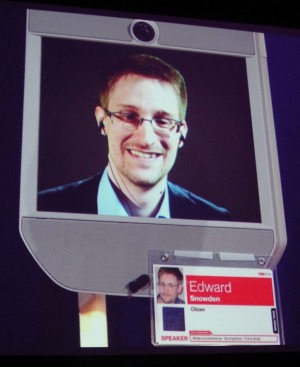 With a grim smile, Edward Snowden at the conference said that 'There are absolutely more revelations to come' and that 'some of the most important reporting to be done is yet to come.' With a grim smile, Edward Snowden at the conference said that 'There are absolutely more revelations to come' and that 'some of the most important reporting to be done is yet to come.'