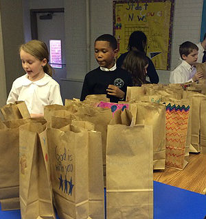 The school-wide project was part of a larger venture organized by Catholic Charities. Entitled 'Cup of Joe,' the initiative brings together volunteer groups to assemble healthy breakfasts for up to 1,300 men and women staying at Catholic Charities shelters every single night. The school-wide project was part of a larger venture organized by Catholic Charities. Entitled 'Cup of Joe,' the initiative brings together volunteer groups to assemble healthy breakfasts for up to 1,300 men and women staying at Catholic Charities shelters every single night.