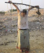 An unidentified man is crucified by Muslim extremists after being accused of spying for the US. Image of An unidentified man is crucified by Muslim extremists after being accused of spying for the US.