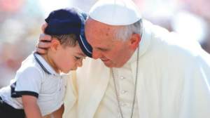 Pope Francis embraces a child in St. Peter's Square. Pope Francis embraces a child in St. Peter's Square.
