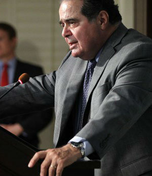 Justice Scalia told the students that the justices do not give credence to partisan politics, and that he doesn't care which party controls the White House. He stands by a theory of 'originalism,' which means that the Constitution is a fixed law and not open to change or interpretation over time. Justice Scalia told the students that the justices do not give credence to partisan politics, and that he doesn't care which party controls the White House. He stands by a theory of 'originalism,' which means that the Constitution is a fixed law and not open to change or interpretation over time.