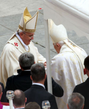 Two pontiffs, one active, the other retired - Pope Francis and Pope Benedict were on hand to elevate two previous Popes, John XXIII and John Paul II to sainthood. Two pontiffs, one active, the other retired - Pope Francis and Pope Benedict were on hand to elevate two previous Popes, John XXIII and John Paul II to sainthood.