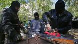 Pro-Russian separatists refurbish rifles in Eastern Ukraine. Image of Pro-Russian separatists refurbish rifles in Eastern Ukraine.