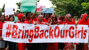 A group of Nigerians holding banners urging the Muslim group Boko Haram to return the more than 200 girls they kidnapped in mid-April. A group of Nigerians holding banners urging the Muslim group Boko Haram to return the more than 200 girls they kidnapped in mid-April.