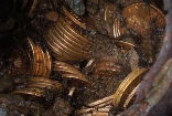 The $11 million worth of gold coins were found in eight cans, buried in a northern California couple's yard. Image of The $11 million worth of gold coins were found in eight cans, buried in a northern California couple's yard.