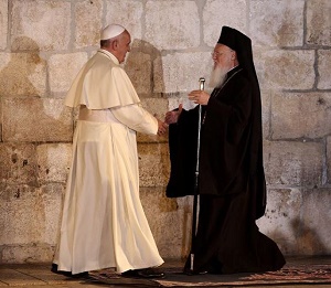 Pope and Patriarch pray in humility at the Stone of Unction at the Holy Sepulcher in Jerusalem. May such humility help to advance the full communion of the Church. Pope and Patriarch pray in humility at the Stone of Unction at the Holy Sepulcher in Jerusalem. May such humility help to advance the full communion of the Church.