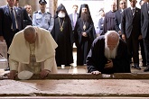 Pope and Patriarch pray in humility at the Stone of Unction at the Holy Sepulcher in Jerusalem. May such humility help to advance the full communion of the Church. Image of Pope and Patriarch pray in humility at the Stone of Unction at the Holy Sepulcher in Jerusalem. May such humility help to advance the full communion of the Church.