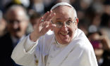 The Pope lost his skullcap to a gust of wind during an appearance at Saint Peter's square. Image of The Pope lost his skullcap to a gust of wind during an appearance at Saint Peter's square.