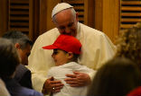 Pope Francis embraces a young student on May 31, 2014 in Paul VI audience hall. Image of Pope Francis embraces a young student on May 31, 2014 in Paul VI audience hall.