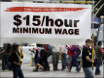 Seattle residents gathered to support the measure to increase the city's minimum wage to $15 an hour. Image of Seattle residents gathered to support the measure to increase the city's minimum wage to $15 an hour.