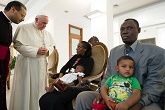 Pope Francis giving a blessing to Meriam and her youngest child Image of Pope Francis giving a blessing to Meriam and her youngest child