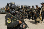 Members of Iraq's military special forces outside Tikrit. Image of Members of Iraq's military special forces outside Tikrit.