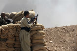Kurdish fighters stand watch in northern Iraq for fighters from the Islamic State. Image of Kurdish fighters stand watch in northern Iraq for fighters from the Islamic State.
