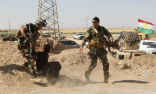 Kurdish forces with a captured Islamic State fighter. Image of Kurdish forces with a captured Islamic State fighter.