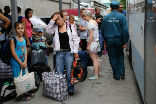 Ukrainian refugees at a Russian train station. Image of Ukrainian refugees at a Russian train station.