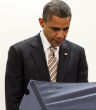 President Obama casting his early vote in Illinois for the 2014 midterm. Image of President Obama casting his early vote in Illinois for the 2014 midterm.