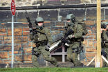 Armed members of Canada's Royal Mounted Police are searching for an unknown number of shooters in Ottawa, Canada's capital. Image of Armed members of Canada's Royal Mounted Police are searching for an unknown number of shooters in Ottawa, Canada's capital.
