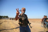 A Kurdish fighter engaged against the Islamic State in the Syrian town of Kobane, near the Turkish border. Image of A Kurdish fighter engaged against the Islamic State in the Syrian town of Kobane, near the Turkish border.