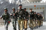 Chinese and Pakistani soldiers conduct a cooperative, joint-border patrol. China has large borders with Russia, Mongolia, Pakistan, India and numerous smaller countries. Image of Chinese and Pakistani soldiers conduct a cooperative, joint-border patrol. China has large borders with Russia, Mongolia, Pakistan, India and numerous smaller countries.