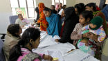 Indian women wait to sign up for sterilization, a program run by the government to help control the billion plus population. Image of Indian women wait to sign up for sterilization, a program run by the government to help control the billion plus population.