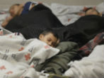 Children in holding facilities during 2014, a year where the surge of illegal children occurred. Image of Children in holding facilities during 2014, a year where the surge of illegal children occurred.