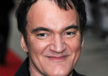 Bad boy movie director Quentin Tarantino -- looking smug! Image of Bad boy movie director Quentin Tarantino -- looking smug!
