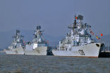 China's ongoing project of building islands for military use in the South China Sea is seen by many as confrontational and preparation for war. Image of China's ongoing project of building islands for military use in the South China Sea is seen by many as confrontational and preparation for war.