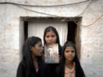 The daughters of Asia Bibi, with a photograph of their mother. Image of The daughters of Asia Bibi, with a photograph of their mother.