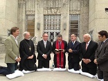 Emergency delegation of pastors prays in front of Houston City Hall before meeting with Mayor Annise Parker Image of Emergency delegation of pastors prays in front of Houston City Hall before meeting with Mayor Annise Parker