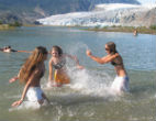 Swimmers keep cool playing in an Alaskan lake amid record-breaking heatwaves in the state. Image of Swimmers keep cool playing in an Alaskan lake amid record-breaking heatwaves in the state.