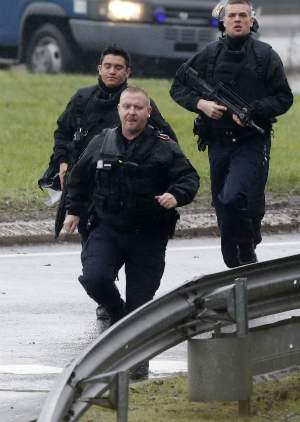 Police storm the locations of terrorist brothers and their accomplice Friday morning after hostages were taken in. Police storm the locations of terrorist brothers and their accomplice Friday morning after hostages were taken in.